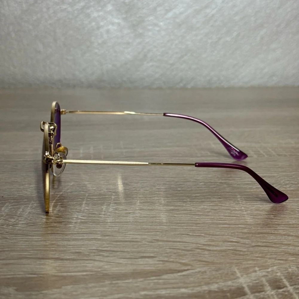 Rainbow OPTX Round sunglasses a gold metal frame and indigo purple lenses